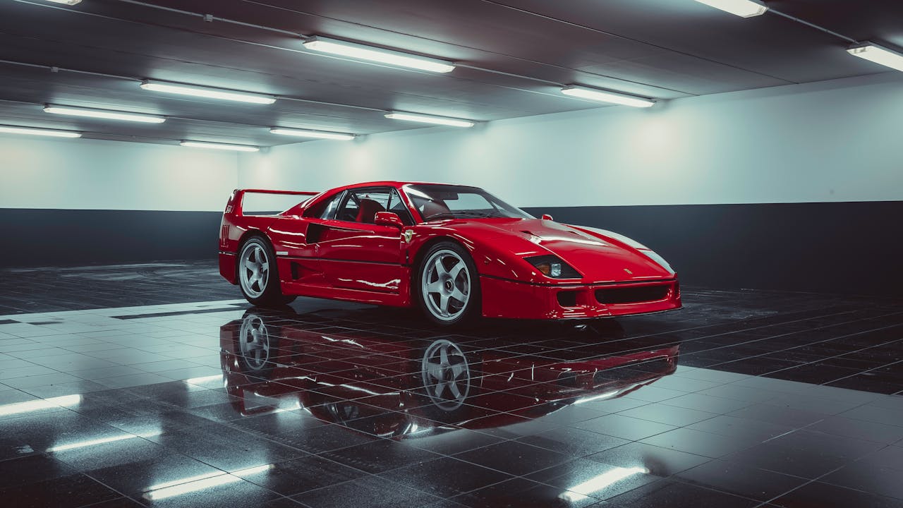 Stunning red Ferrari sports car showcased in a sleek indoor parking area.